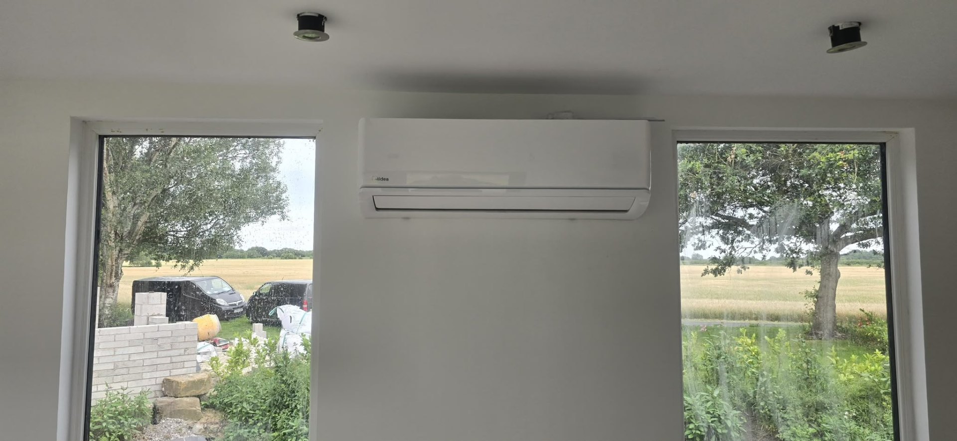 Multi-split air conditioning system with twin wall units serving a North West retail space.