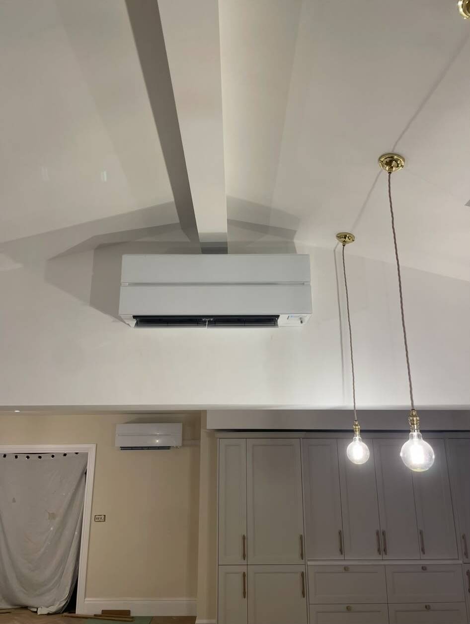 Mitsubishi Electric wall-mounted air conditioning installed in a high-ceiling domestic kitchen - both domestic and commercial work undertaken across the North West.