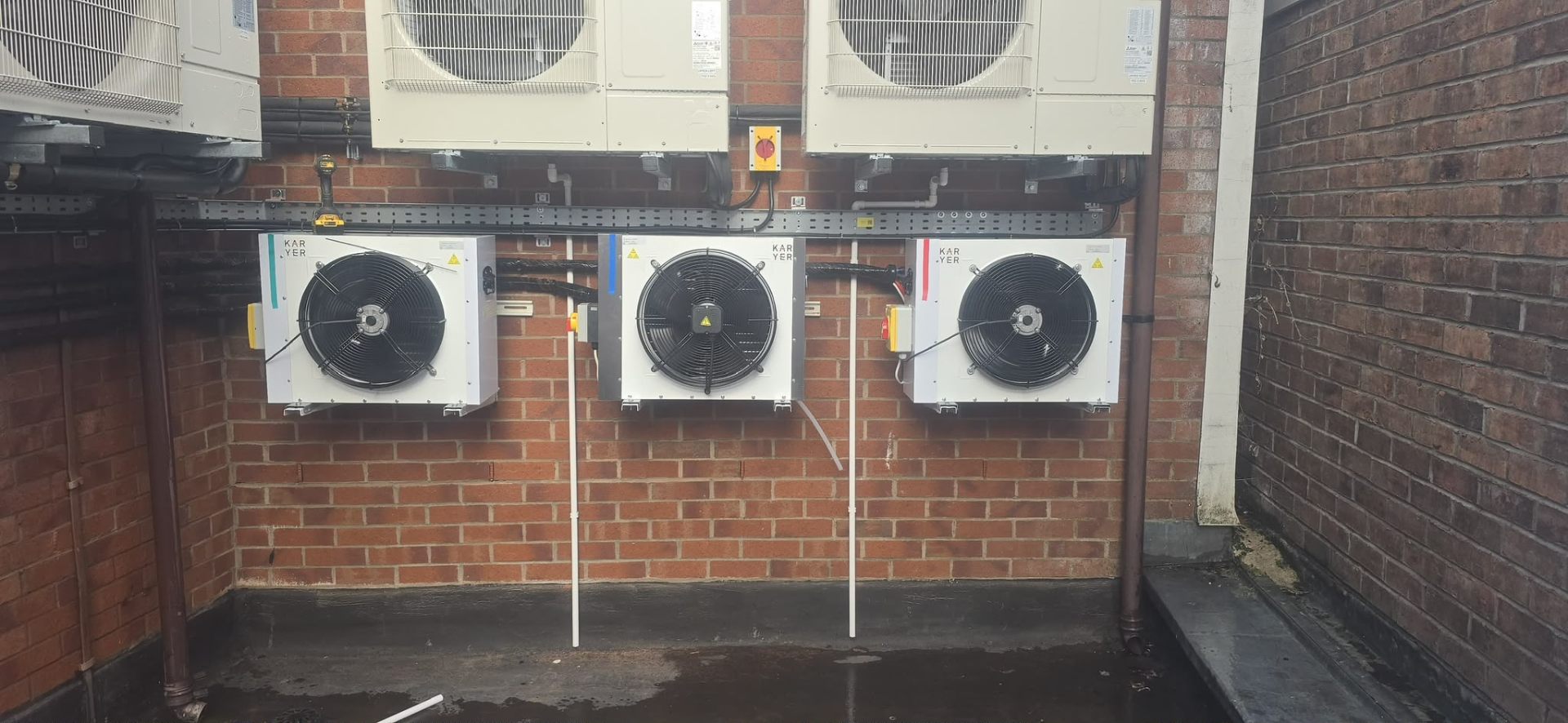 Karyer evaporator fans paired with outdoor condensers - commercial refrigeration install by JC Heating and Cooling.