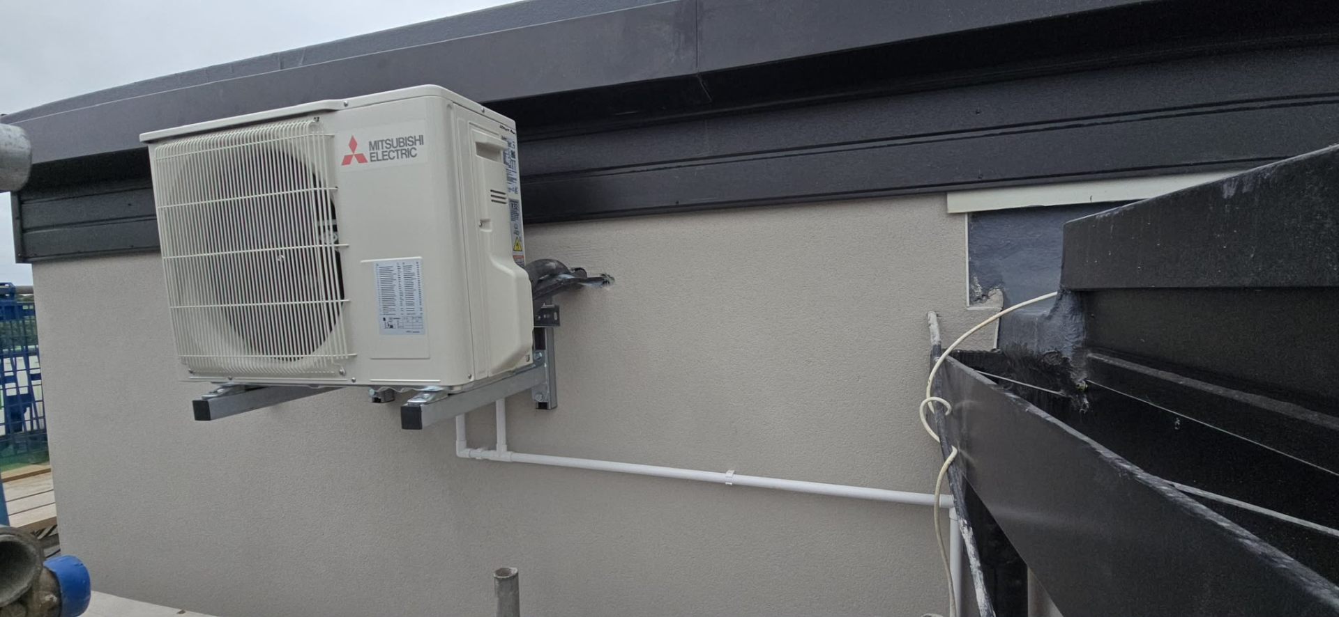 Wall-mounted split air conditioning serving a small business unit in the North West.